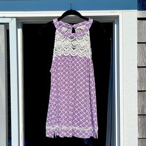 High neck tank top with key hole cut out in back. Cotton lace detailing.